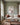 Lost lamb canvas wall art in three scenes hanging above an ivory linen sofa in a sage green living room