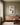 Canvas of Jesus rescuing the lost lamb above a white oak credenza in a quiet prayer corner with a kneeling bench