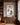 Jesus and the lost lamb canvas print between walnut bookcases in a private home library