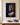 Canvas print of a lion keeping watch over a sleeping white lamb with wolves' eyes glowing in the dark, front view on a cream plaster wall