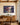 Landscape canvas of Jesus on the water holding a man, hung over a quarter-sawn oak sideboard in a dining room