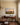 Great is your faithfulness verse canvas in oil-painting style above a mahogany sideboard in a cream dining room