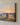 Close-up of the gallery-wrapped canvas edge showing the brushwork-style sunrise sky, oak tree and split-rail fence