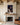 John 10:18 canvas wall art of Christ with bowed head centered above a limestone fireplace and oak mantel