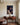 Canvas of Jesus before the cross with three distant crosses, hung above a mahogany sideboard in a dining room