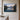 Mountain lake sunrise canvas with Psalm 121:1-2 hanging on a warm greige limewashed plaster wall
