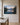 Mountain lake sunrise canvas with Psalm 121:1-2 hanging on a warm greige limewashed plaster wall