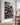 Christian canvas wall art in a bright coastal Cape Cod hallway with white paneled walls