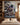Large canvas of Jesus and wolves above a bed in a warm Craftsman-style bedroom with oak wainscoting