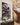 Tall canvas of Jesus protecting a lamb from wolves above a console table in a grand transitional foyer