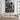 Canvas of Jesus guarding a lamb from wolves displayed above a linen sofa in a modern farmhouse living room with shiplap walls