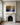 Jesus praying in Gethsemane canvas on the ivory chimney breast above a carved white Carrara marble fireplace
