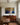 Gethsemane prayer canvas above a mahogany sideboard in a dove-grey panelled dining room