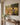 Christian canvas wall art of a lamb running to Jesus above a console table in a transitional-style entryway