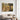 Canvas of a lamb running to Jesus on a clean white wall in a bright modern minimalist living room