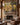 Wide canvas of a lamb running to Jesus above a stone fireplace mantel in a rustic mountain lodge great room
