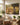 Lamb running to Jesus canvas in a sunny Southern traditional sunroom breakfast nook with wicker furniture