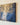 Close-up of the right end of the panoramic canvas showing the wrapped edge and Jesus kneeling in a shaft of light