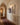 Christian canvas wall art as part of a gallery wall display in an arched hallway