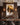 Jesus Lion of Judah canvas above a walnut sideboard in a formal dining room with brass chandelier