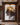 Lion of Judah double-exposure canvas in a dark walnut-paneled hallway gallery with marble floor