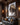 Jesus Lion of Judah canvas in a dark walnut home theater lounge with charcoal leather recliner sofa