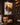 Jesus Lion of Judah canvas in a floor-to-ceiling dark walnut home library with leather club chair