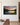 River sunset canvas with the Mark 12:30 verse hanging on a warm white plaster wall beside a walnut and marble table