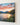 Close view of the gallery-wrapped canvas edge showing the sunset, river and purple wildflowers