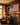 Man in the Arena American flag canvas hanging above a fireplace in a craftsman-style home library