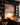 Man in the Arena canvas hanging above a wood desk in a home library