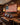 Man in the Arena American flag canvas hanging in a masculine man cave with leather sofa