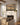 Second Coming of Christ canvas hung above a farmhouse fireplace mantel with shiplap wall
