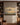 Heavenly army canvas art hung between built-in bookshelves in a craftsman den