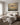 Revelation-inspired canvas print above an upholstered bed headboard in a bedroom