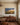 Painted prairie road canvas with the verse For I know the plans above a walnut sideboard in a dining room