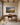 Painting-style Jeremiah 29:11 landscape canvas hanging above a walnut writing desk in a home office