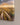 Close-up of the canvas corner showing the printed brushstroke detail and the 1.25 inch gallery-wrapped edge against the wall