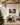 48 x 32 inch manger and cross canvas above a linen sectional in a great room with oak beams and a Christmas tree