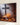 Close-up of the gallery-wrapped canvas edge showing the sleeping Child in the manger, the white lamb and the cross shadow