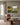 Psalm 23 still waters painting-style canvas hanging above a flax linen sofa in a bright living room with tall windows and a rust wool throw