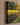 Close-up of the left edge of the gallery-wrapped canvas showing the 1.25 inch wrapped side and the painted golden trees reflected in still water