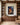 Good Shepherd with lantern canvas print between walnut bookcases in a pastor's study and counseling room